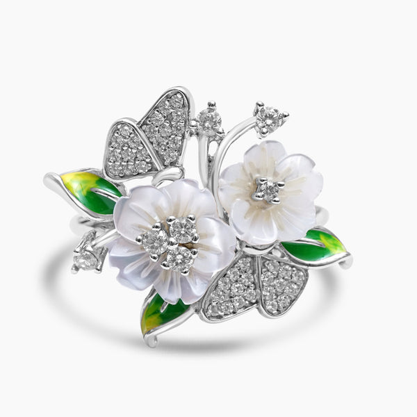 A silver ring featuring a floral design with mother of pearl flowers, enamel butterflies, and zircon embellishments.