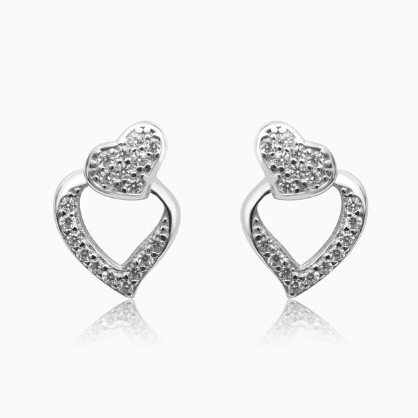 A pair of silver heart-shaped earrings with sparkling zirconia stones