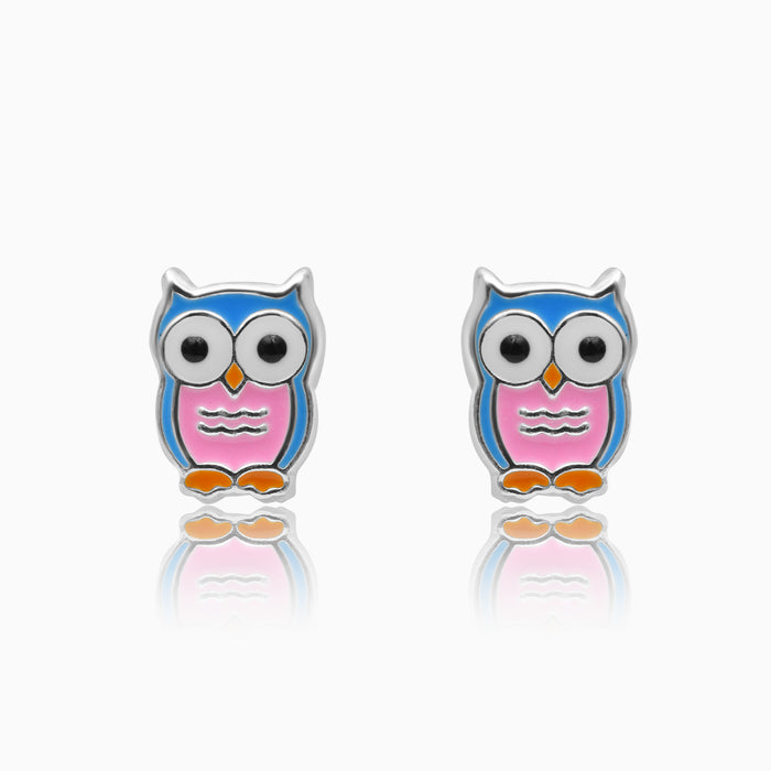 A pair of kids' screw back earrings featuring a silver owl design with blue and pink accents.