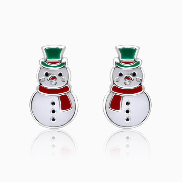 A pair of silver kids' earrings shaped like snowmen with green and red hats.
