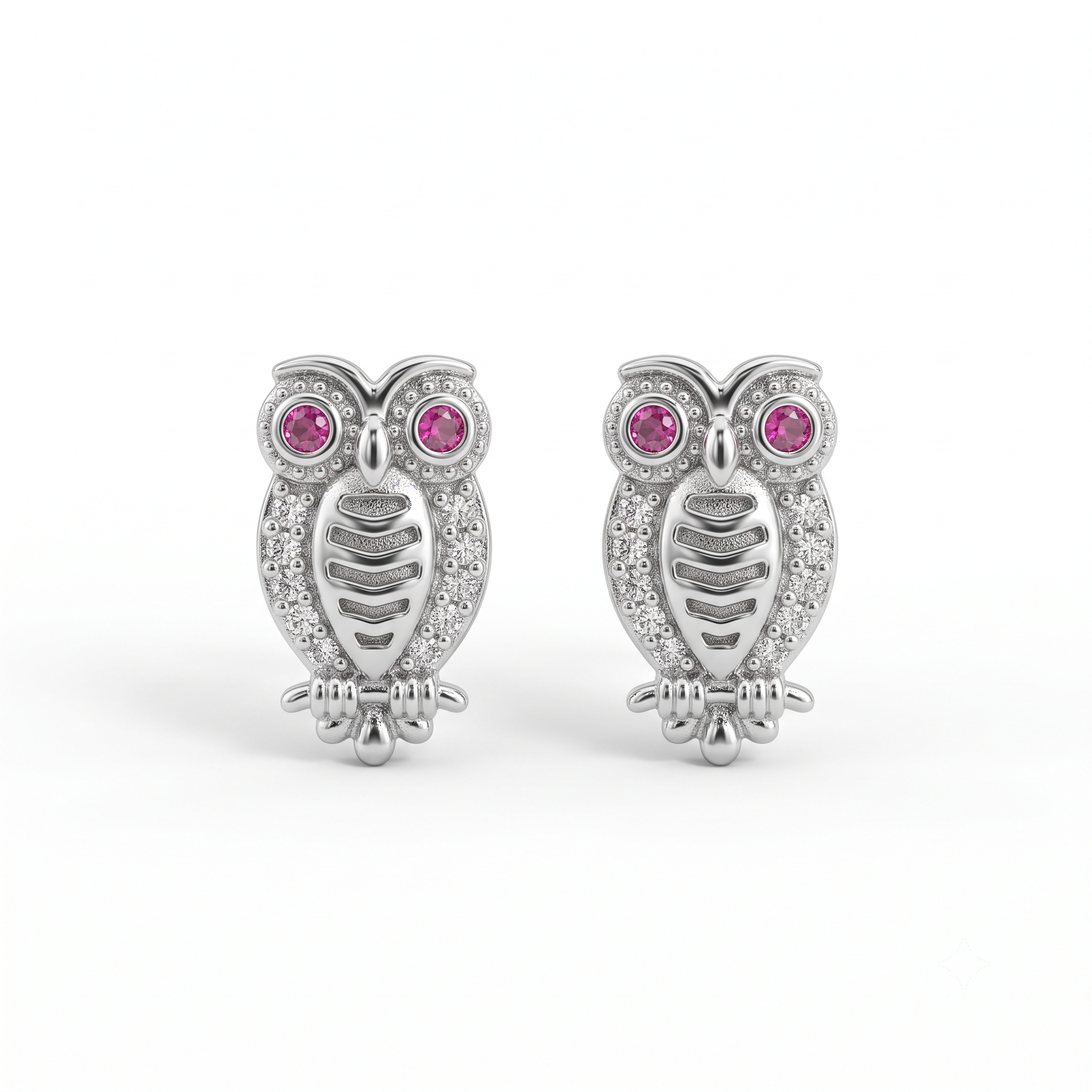 A pair of silver owl stud earrings with pink gemstone eyes and clear crystal details, set against a plain white background.