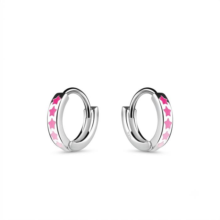 A pair of silver huggie hoop earrings with pink star-shaped enamel inlays, shown on a clean white background.