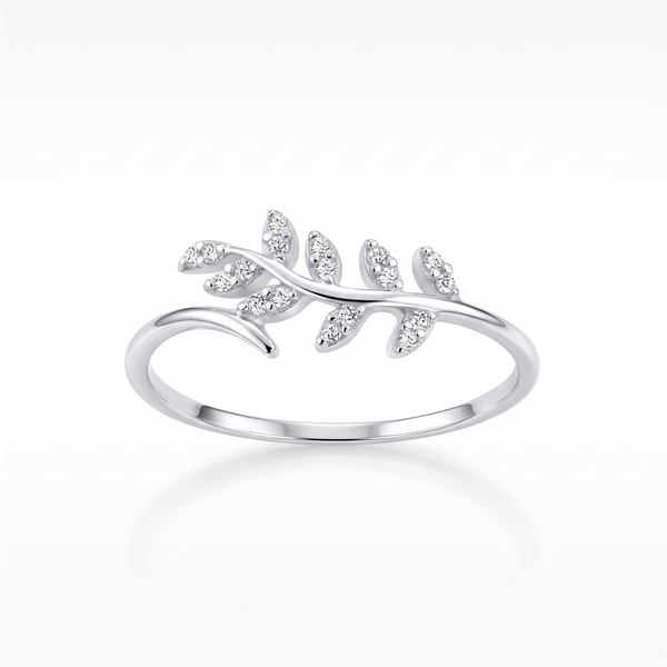A silver ring featuring a delicate leaf branch design set with small clear marquise-cut stones, shown on a clean white background with a soft reflection.