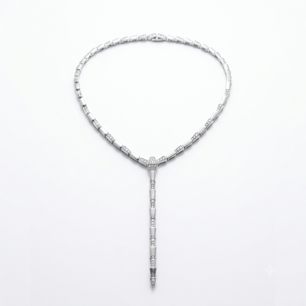 A silver-toned Art Deco style necklace with a Y-shaped drop, featuring rectangular and cylindrical links set with clear stones, photographed on a clean white background.