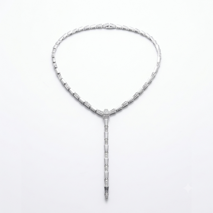 A silver-toned Art Deco style necklace with a Y-shaped drop, featuring rectangular and cylindrical links set with clear stones, photographed on a clean white background.
